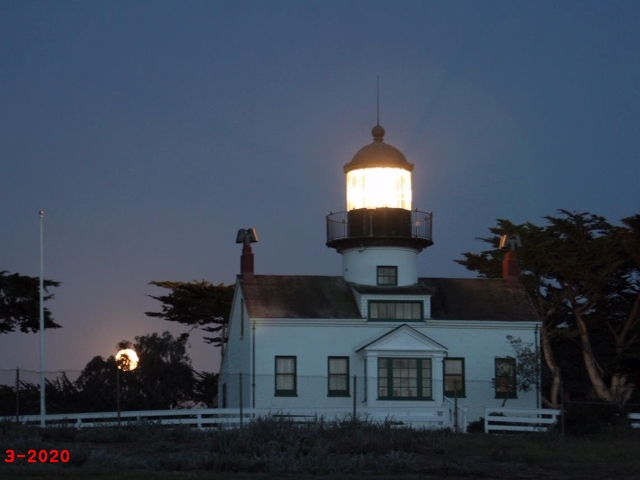 moonrise over lighthouse